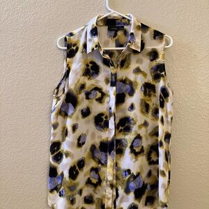 Summer top, button down, wear alone or use as an outer shirt! Slit in the back!